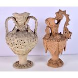 AN UNUSUAL EARLY 20TH CENTURY CONTINENTAL TWIN HANDLED VASE together with a similar ewer. Largest 18