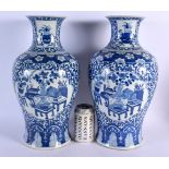 A LARGE PAIR OF 19TH CENTURY CHINESE BLUE AND WHITE PORCELAIN VASES Kangxi style. 40 cm x 18 cm.