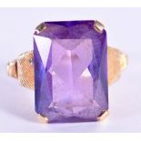 A GOLD AND AMETHYST RING. O. 7.2 grams.