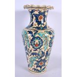 A TURKISH MIDDLE EASTERN FAIENCE POTTERY VASE painted with flowers. 29 cm high.