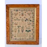 A framed sampler dated 1840 43 x 30 cm.