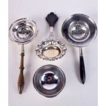 THREE SILVER STRAINING SPOONS and a Continental silver cup. 170 grams. Largest 15 cm wide. (4)