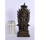 A GOOD 19TH CENTURY INDIAN BRONZE FIGURE OF A STANDING BUDDHA modelled upon a rectangular base. 27 c