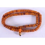 A MIDDLE EASTERN AMBER AND BONE PRAYER BEAD NECKLACE. 107 grams. 76 cm long.