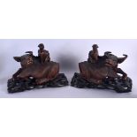 A PAIR OF 19TH CENTURY CHINESE CARVED HARDWOOD BUFFALOS ON STAND Qing. 25 cm x 21 cm.