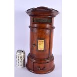A CONTEMPORARY CARVED WOOD POST BOX. 44 cm x 14 cm.