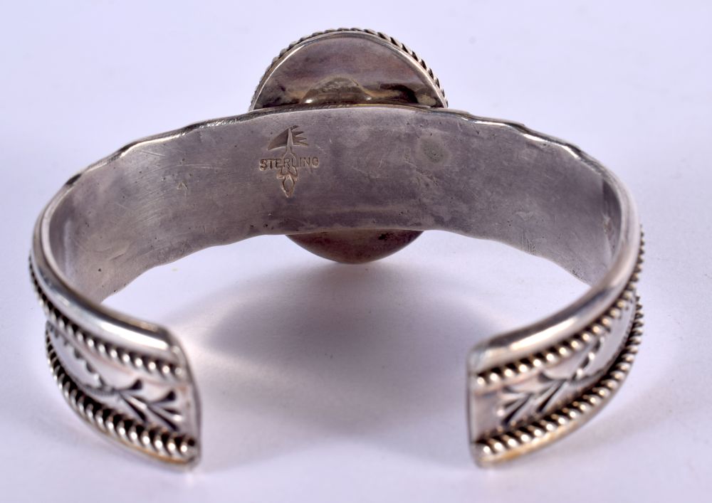 NATIVE AMERICAN SILVER AND TURQUOISE BANGLE. Stamped Sterling, 6.1cm x 4.6cm, weight 71.3g - Image 2 of 2
