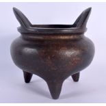 A CHINESE QING DYNASTY TWIN HANDLED BRONZE CENSER bearing Xuande marks to base. 1373 grams. 13 cm wi