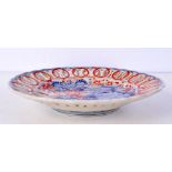 A 19th century Japanese dish with open work design decorated with flowers.22cm.