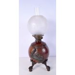 A Benson style aesthetic movement hammered copper oil lamp with etched glass shade , eagle claw fee