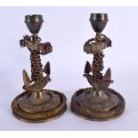 A PAIR OF EARLY 20TH CENTURY EUROPEAN BRONZE MARITIME CANDLESTICKS formed with anchors. 16 cm high.