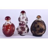 THREE 19TH CENTURY CHINESE PEKING GLASS SNUFF BOTTLES. Largest 7 cm x 4.25 cm. (3)