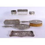 AN ANTIQUE INDIAN WHITE METAL DRESSING TABLE SET. 1551 grams overall. Largest 30 cm x 11 cm. (qty)