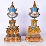 A pair of French 19th Century gilt Ormolu vases with stands 34 cm (2).
