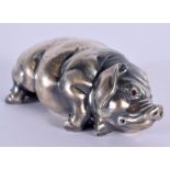 A CONTINENTAL SILVER FIGURE OF A SLEEPING PIG. 40 grams. 7.25 cm x 3.5 cm.