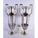 A LARGE PAIR OF WMF SILVER PLATED VASES. 42 cm x 17 cm.