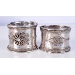 A PAIR OF 19TH CENTURY MIDDLE EASTERN SILVER BANGLES. 125 grams. 6.5 cm x 5.25 cm.