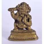 AN EARLY 20TH CENTURY SINO TIBETAN BRONZE FIGURE OF A BUDDHA modelled holding a phurba. 6 cm x 4 cm.