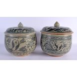 A PAIR OF 19TH CENTURY SOUTH EAST ASIAN POTTERY BOWLS AND COVERS possibly ship wreck, painted with f