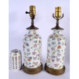 A PAIR OF EARLY 20TH CENTURY CHINESE FAMILLE ROSE PORCELAIN LAMPS Late Qing/Republic. 38 cm high.