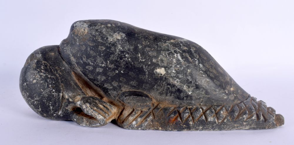 AN UNUSUAL EARLY NORTH AMERICAN INUIT CARVED STONE FIGURE modelled as a whale attacking a sea lion. - Image 3 of 4