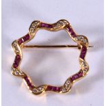 AN 18CT GOLD BROOCH SET WITH DIAMONDS AND RUBIES. Stamped 18K, 2.4cm diameter, weight 4.1g