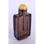 A FINE CHINESE QING DYNASTY CARVED SMOKEY QUARTZ CRYSTAL SNUFF BOTTLE with silver and amber stopper.