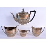 A FOUR PIECE SILVER TEASET. Sheffield 1904 & 1905. 1209 grams. Largest 30 cm x 18 cm. (4)