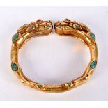 A Chinese gilt metal Dragon bracelet with turquoise stone insets 8 x 7 cm .