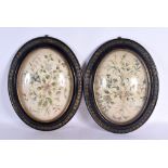 A FINE PAIR OF LATE GEORGE III GLASS CASED NEEDLE WORK PANELS of lovely original colour, formed with