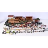 A vintage child's farm yard set with wooden buildings and a large collection of painted lead animals
