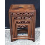 A 19th Century nest of carved Chinese tables largest 71 cm x 48 x 34 (4)