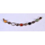 A 14CT GOLD AND MULTI COLOURED JADE BRACELET. Stamped 14K, 18cm long, weight 12.7g