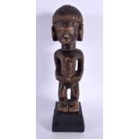 AN AFRICAN TRIBAL CARVED WOOD FIGURE. 28 cm high.