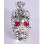 A SILVER AND RUBY SKULL SCENT BOTTLE. 74 grams. 6 cm x 4.25 cm.