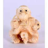 A JAPANESE CARVED BONE MONKEY. 4 cm x 3 cm.