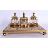 A 19TH CENTURY ENGLISH GILT METAL AND SILVER PLATED INKWELL in the manner of Elkington, decorated al