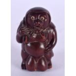 A JAPANESE CARVED BEAR NETSUKE. 5 cm x 3 cm.