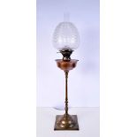 A Benson Oil lamp with a stamped copper reservoir and an etched glass shade, 81 cm .