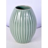 A small Chinese porcelain barrel shaped ridded Celadon vase bearing Qianlong mark . 12 cm.
