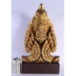 A LARGE THAI GILTWOOD SCULPTURE OF A BUDDHISTIC DEITY modelled with hands clasped. 50 cm x 25 cm.