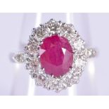 A FINE PLATINUM DIAMOND AND RUBY RING. 6.6 grams. O.