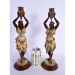 A PAIR OF LATE 19TH CENTURY COLD PAINTED SPELTER CANDLESTICKS. 38 cm high.