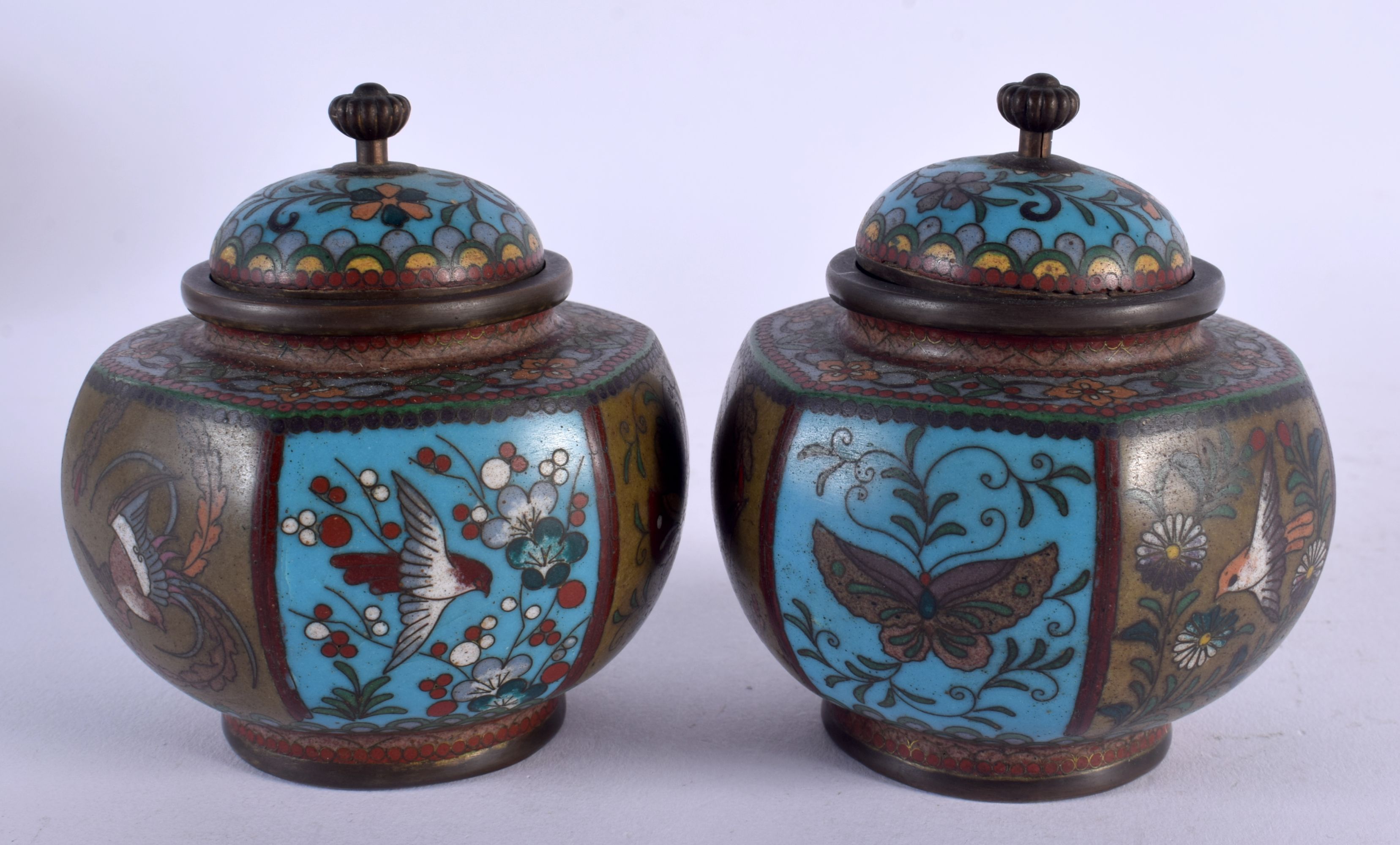 A PAIR OF 19TH CENTURY JAPANESE MEIJI PERIOD CLOISONNE ENAMEL JARS AND COVERS decorated with insects