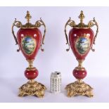 A PAIR OF PAIR OF CONTINENTAL TWIN HANDLED PORCELAIN VASES with bronze mounts. 46 cm x 15 cm.
