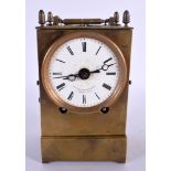 AN UNUSUAL ANTIQUE FRENCH OPEN ESCAPEMENT BRASS CLOCK. 15 cm high inc handle.