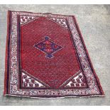 A Persian rug 209 x 133 cm