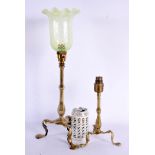 TWO ART NOUVEAU BRASS CANDLESTICKS one with vaseline glass lamp fittings. Largest 47 cm high. (2)