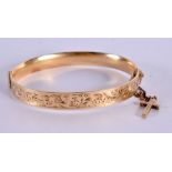 A GOLD FILLED BANGLE. 23 grams. 6 cm x 5 cm.