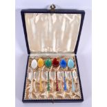 A CASED SET OF VINTAGE DANISH SILVER GILT AND ENAMEL SPOONS. 49.5 grams. 9 cm x 1.75 cm. (6)